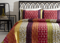 BT Home Emma quilt set. Mountain Bohemian bedding, saddle stitch hand-quilted. Dark purple, pinks, gold, limon green